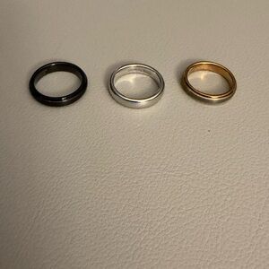 Elegant Trio of Black, Silver, and Gold Comfort Rings